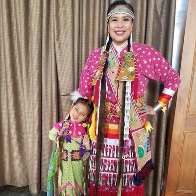 photo of woman and child dressed in native people attire